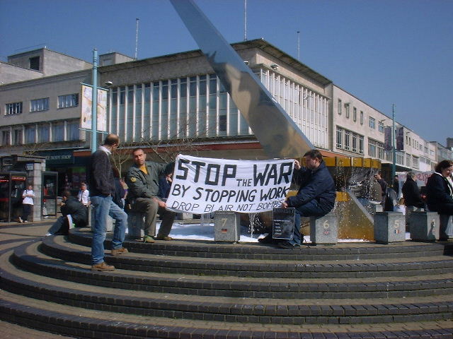 lunchtime protest in Plymouth. The banner reads: stop the war by stopping work. Drop Blair not Bombs.