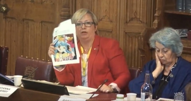 Joanna Cherry holding up a poster of Lily saying shut the fuck up terf