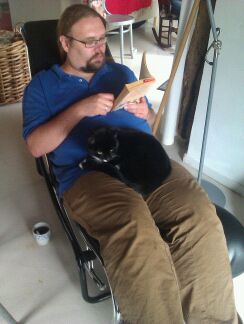 Martin with cat, reading