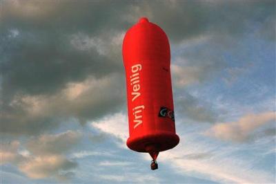 A huge pink hot air balloon flies above the Zwarte Cross, or Black... (AP Photo/Ermindo Armino)