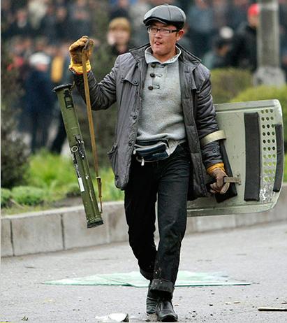 Hipster protester in  Bishkek got himself an rpg and riot shield