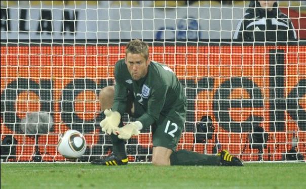 Goalie Robert Green manages to not quite catch the ball