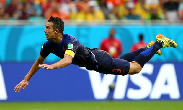 Robin van Persie dives to head home the equaliser for Holland against Spain