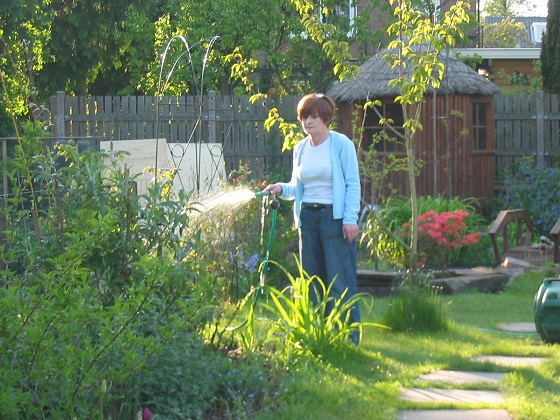sandra watering the garden