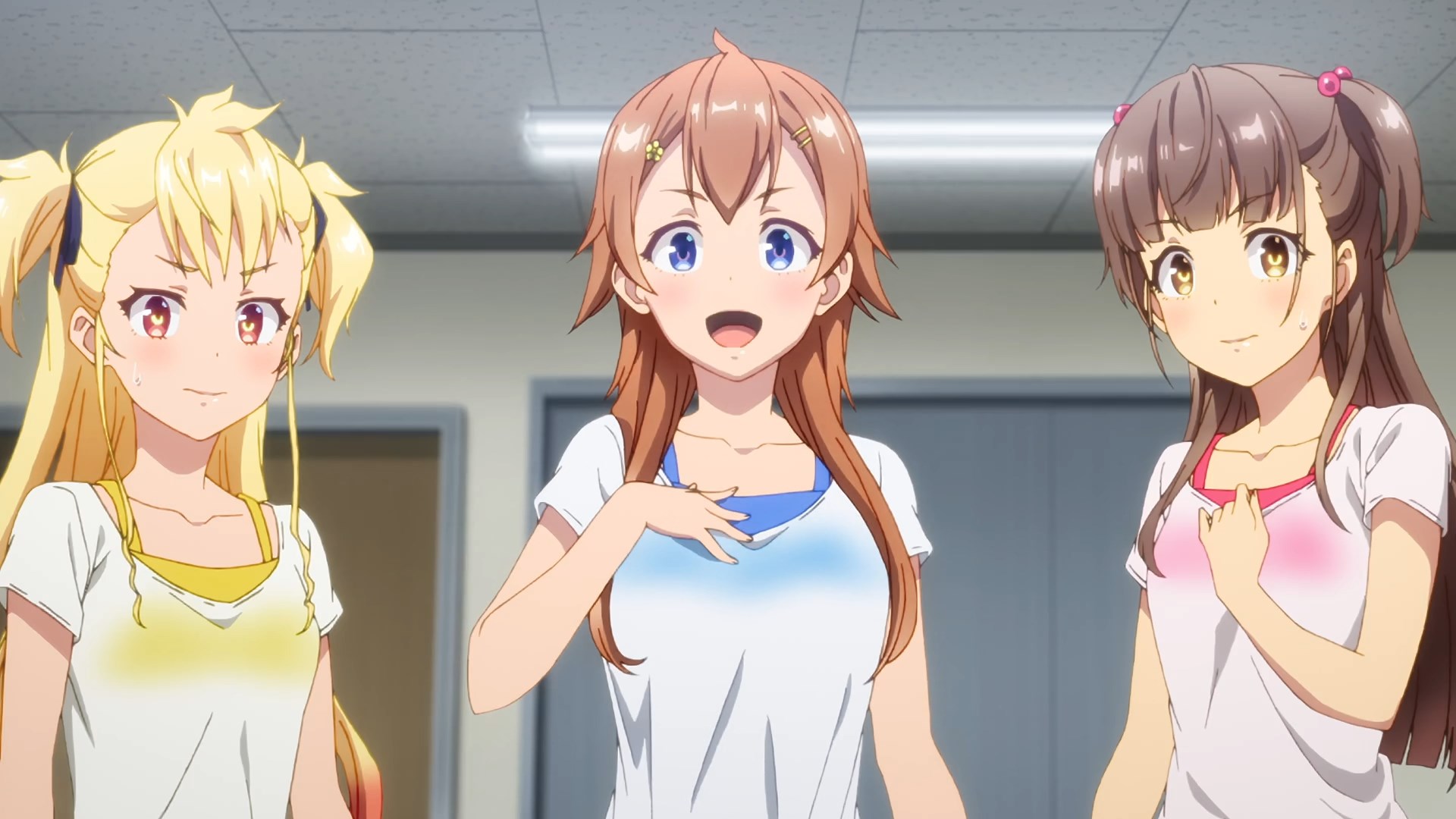 Three idol girls in fitness clothing looking directly at the camera