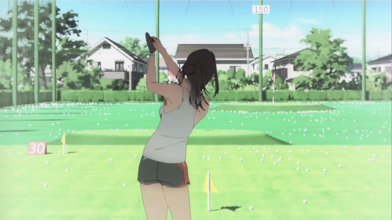 A girl in shorts and t-shirt who is holding up a golf club, having just swung it